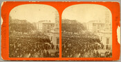 Stereoview photograph of people in Monument Square of Baltimore, Maryland, on May 19, 1870 celebrating the passage of the 15th Amendment, which gave African American men the right to vote. The images show a parade crowd gathered at the Battle Monument on Calvert Street, between Fayette and Lexington Streets. The celebratory parade began in Fells…