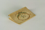 Embroidered card case, probably belonged to Mrs. Catherine Marshall Finley (Ebenezer Finley). Features embroidered floral wreath with the phrase "Forget me Not" in its center. Catherine Marshall married Ebenezer Finely on Oct. 17, 1809. According to church records of Middle Spring Presbyterian in Cumberland Co., PA, they paid $20 for the wedding.