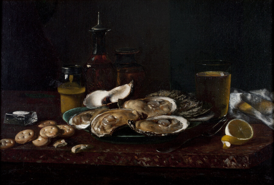 Still life scene of a green plate full of oysters on the half shell on a red marble slab. The dish is accompanied by crackers strewn across the surface, a peeled lemon, and a beverage. Other jars and bottles sit on the table behind the plate.
