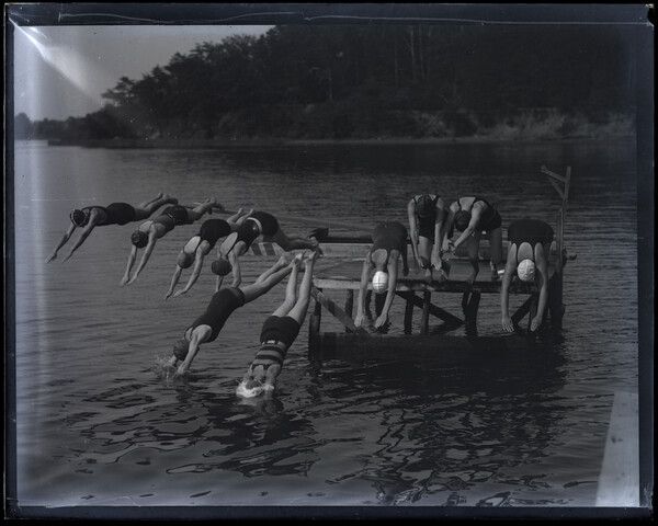 Women diving off pier at YWCA Camp Pawatinka — 1929