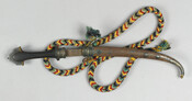 Dagger (Jambiya) with sheath and braided belt. Likely a Middle Eastern dagger (Jambiya) with a braided belt. Jambiya is from the Hampton mansion and was likely purchased by the Ridgley family between 1846-1848 during their Grand Tour of Europe, in which they visited the Ottoman Empire.