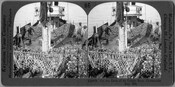 Stereoview photograph of the deck of an oyster boat in the Chesapeake Bay, Maryland. The view shows thousands of oysters that have been dredged from the ocean bottom and hauled on deck with nets by African American crew members. A dredge with attached net can be seen in the foreground, with another being emptied on…