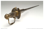 Rapier with silver gilt grip and guard. Given to Governor Thomas Johnson (1732-1819) by George Washington (1732-1799), said to have been presented at Valley Forge. Triangular blade decorated and engraved on one side with the phrase "Si Fortune me tourment," and the other side "La Fortune me Contente."