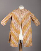 An infant's calico-printed cotton coat with yellow and white vertical stripes. Overlaid on these stripes are columns of red and black lozenges. It closes in front with two mother of pearl buttons. This infant's coat and a woman's hip length jacket (sacque) were made from a dress worn by Margaretta Sophia Howard Ridgely (1824-1904) prior…