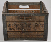 Crate for carrying milk bottles from the Western Maryland Dairy (1889–1940) company.
