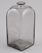 Square Amelung glass bottle. Engraved on the bottle's front is "B. Johnson / 1788." John Amelung, a German immigrant and glassmaker, settled in Frederick County, Maryland in 1784. The following year he was in business producing fine tableware, bottles, and windows. Founders, such as such as George Washington, Thomas Jefferson, and Benjamin Franklin were among…