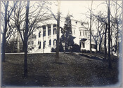 Angled view of the Evergreen House exterior and its grounds. The Evergreen estate was built by Baltimore, Maryland's Broadbent family in 1857, then was sold in 1878 to John Work Garrett, president of the Baltimore and Ohio Railroad. Garrett purchased the estate for his son, and it served as home to two generations of Garretts.…