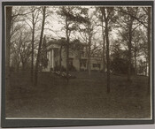 Side view of the Evergreen House exterior and its grounds. The Evergreen estate was built by Baltimore, Maryland's Broadbent family in 1857, then was sold in 1878 to John Work Garrett, president of the Baltimore and Ohio Railroad. Garrett purchased the estate for his son, and it served as home to two generations of Garretts.…