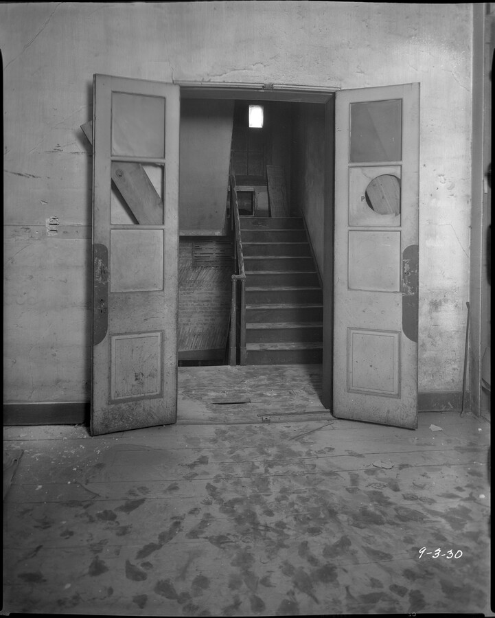 View of doors, stairs, and bare floors at the Peale Museum in Baltimore, Maryland, before the museum's 1930 restoration. Built in 1814 by Rembrandt Peale, the Peale Museum was the first building in North America to be designed and built specifically as a museum. After its 1930 restoration, the museum reopened in 1931 as the…