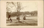 A woman and girl on a footbridge on the grounds of the original Guilford mansion, a home built by William McDonald after inheriting the land from his father General McDonald in 1850. Arunah S. Abell, founder of The Sun, purchased the property in 1872 and it remained in the Abell family until it was sold…
