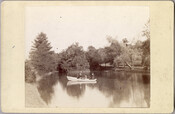 Two women and a child in a small boat on a lake near the original Guilford mansion, a home built by William McDonald after inheriting the land from his father General McDonald in 1850. Arunah S. Abell, founder of The Sun, purchased the property in 1872 and it remained in the Abell family until it…