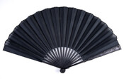 Black silk organza hand fan with carved ebonized ivory handle.