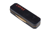 Rectangular black tortoiseshell snuffbox with peach-colored lining and gold trim.