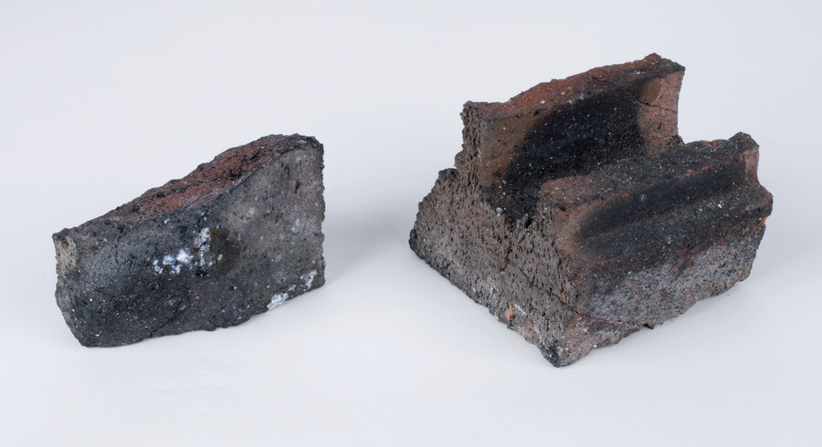 Two pieces of burnt bricks from the Baltimore Uprising on April 27, 2015. Collected at the site of a fire at an unfinished senior center construction site at the corner of North Chester Street and East Lanvale Street.