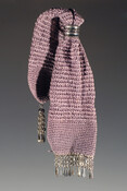 Lavender crocheted silk miser purse with metal ring for closure. Embellished with fringe of teardrop-shaped steel beads at both ends. Belonged to Mary Goulding Bose (1795-1859), first wife of William Bose (1796-1875).
