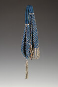 Navy blue crocheted silk miser purse embellished with cut steel beads. Flat end features intertwined cut steel bead fringe. Opposite rounded end finished with a twisted cut steel bead tassel attached with s steel cap. Two faceted one-half inch steel rings to form closure.