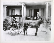 Members of the Perine family sit on the porch of their Homeland estate and in a horse-drawn carriage parked in front. The home was situated in what is now known as the Homeland neighborhood of Baltimore, Maryland.