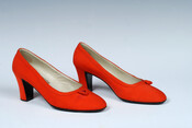 Pair of red silk pumps with square heels worn by the Duchess of Windsor, Wallis Simpson (1896-1986).