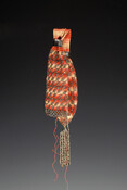 Multicolor knit miser-style purse in cream, pink and orange cotton or silk thread. Embellished with cut steel beads in a checkerboard pattern at bottom end and in an angled pattern at the top. Two twisted bead tassels at bottom are attached with metal caps. Closes with two metal ring closures.