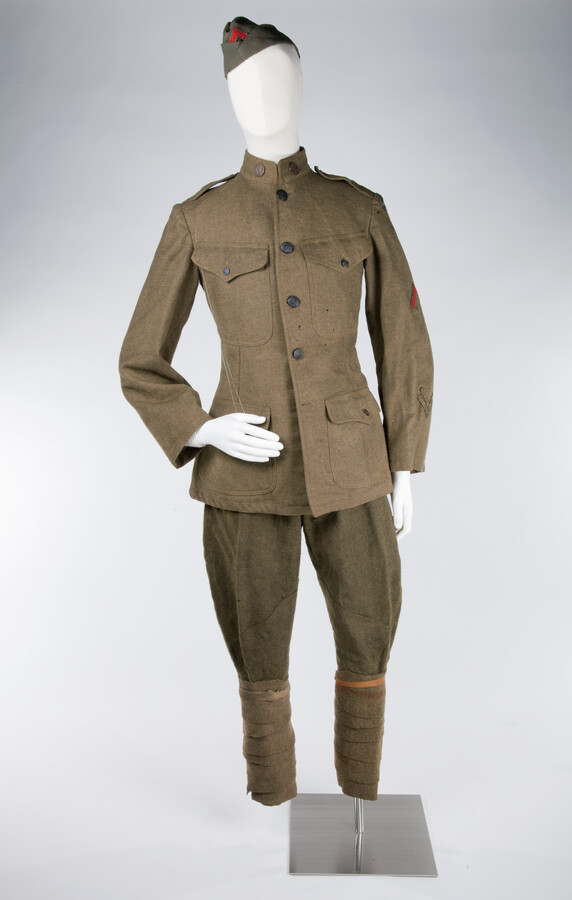World War I Uniform belonging to Jessup More Milstead (1893-1974). Uniform includes one wool field jacket (2015.3.1) with two overseas service chevrons, one honorable discharge chevron, and a 79th Division patch, and one pair of wool service breeches (2015.3.2). Collection also includes a Service Medallion - 312th Machine Gun Battalion Company D (2015.3.3) and a…