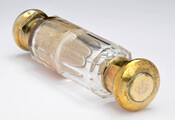 Clear glass two-sided double salts and cologne bottle with gold-colored lids at each end. Bottle engraved with the initials "EPB" for Elizabeth Patterson Bonaparte (1785-1879) and the shape of a crown.