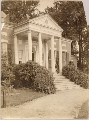 Exterior view of Homewood estate with unidentified woman — circa 1900