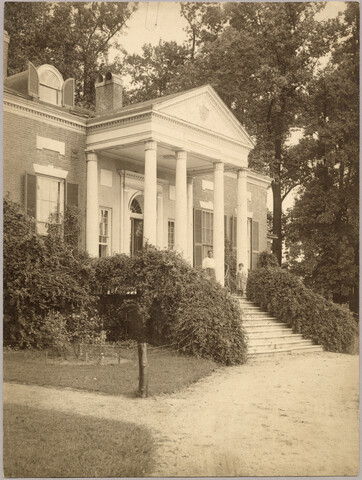 Exterior view of Homewood estate with unidentified adult and child — circa 1900