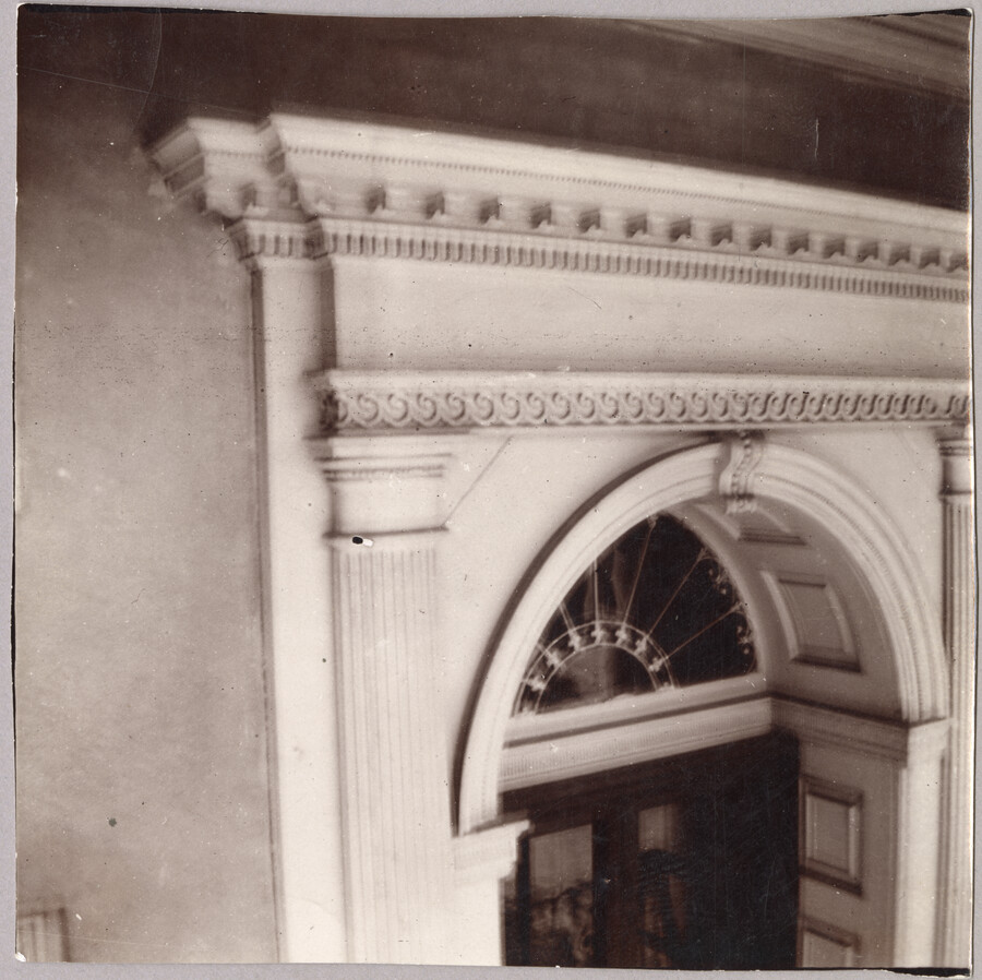 Detailed view of the top of the front door and cornice from the exterior of the Homewood estate. Homewood was built between 1801 and 1806 as a country home for Charles Carroll, Jr., son of Charles Carroll of Carrollton who was a signer of the Declaration of Independence. The Federal-period Palladian home was in the…