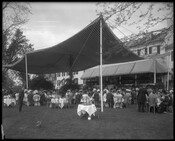 Exterior view of people dining on the grounds of Brooklandwood (or Brookland Wood), an historic home in the Brooklandville community of Baltimore County, Maryland. Built in the mid-1790s on land purchased by Charles Carroll of Carrollton, Brooklandwood became the country home of Richard and Mary Carroll Caton. The estate was later owned by prominent banker…
