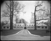 Exterior view of the stables on the grounds of Brooklandwood (or Brookland Wood), an historic home in the Brooklandville community of Baltimore County, Maryland. Built in the mid-1790s on land purchased by Charles Carroll of Carrollton, Brooklandwood became the country home of Richard and Mary Carroll Caton. The estate was later owned by prominent banker…