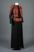 Black rayon crêpe evening dress and jacket ensemble. The jacket is embellished with coral colored beads.