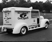 Rear view of a Good Humor ice cream truck. The side reads "Ice Cream Good Humors" with a large graphic of a partially eaten ice cream bar. The rear reads "Ice Cream Sold Here It's Pure Cream Pints In All Flavors," and the door reads "Buy Them Here." The truck is numbered 84.