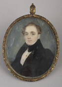 Miniature portrait of Alexander Gould, Sr (c. 1779 – 1859), who is pictured wearing a black coat and stock with a white shirt. He has light brown hair and looks at the viewer as he sits facing toward the left of the composition. The image has a plain gray background. Braided hair is encased and…
