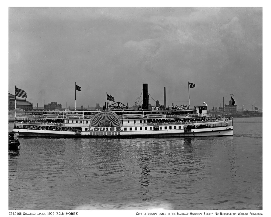 View of "Louise," a sidewheel passenger steamboat that operated on the Chesapeake Bay by the Tolchester Steamboat Company. Acquired in 1882 and active for 40 years, the boat operated from Pier 15 at Light Street in Baltimore, Maryland, and had a capacity of 2,500 passengers.