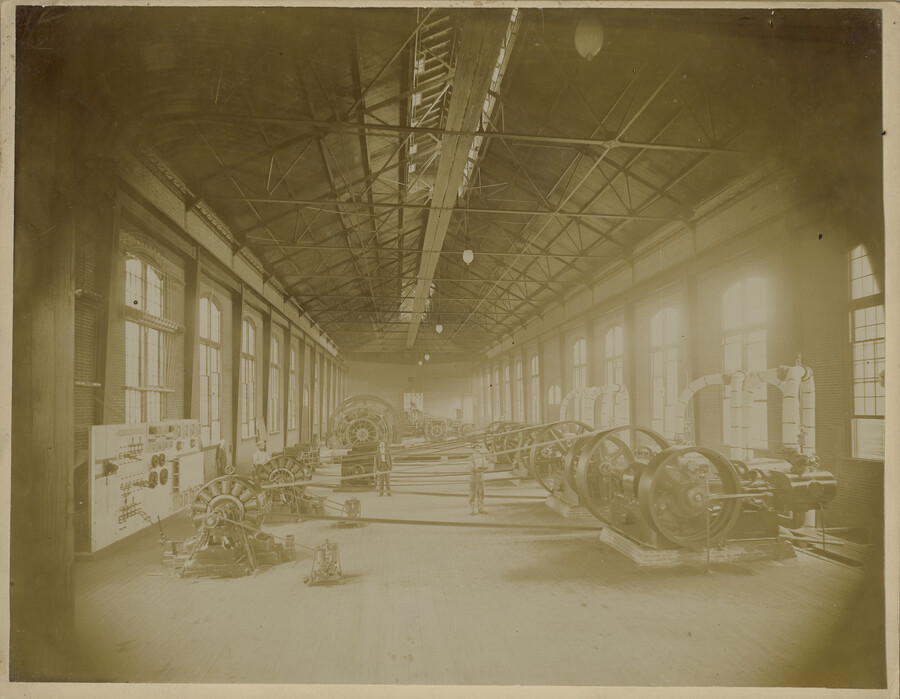 Interior of the Baltimore Belt Line's South Howard Street powerhouse in Baltimore, Maryland. Visible are the 500-Kw electrical generators that produced the power for the electric locomotives to pull Baltimore & Ohio Railroad trains through the 1.4-mile long Howard Street Tunnel, as ventilation issues forbade the use of steam engines. The Baltimore Belt Line was…