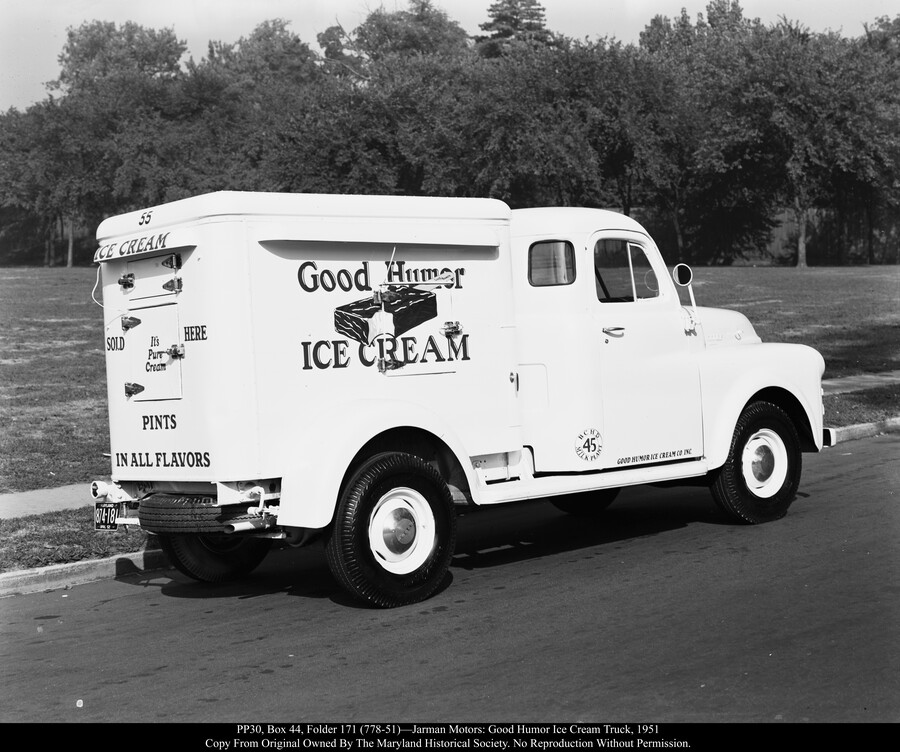 Rear view of a Jarman Motors Good Humor ice cream truck. The side reads "Good Humor Ice Cream," with a large graphic of a partially eaten ice cream bar. The rear reads "Ice Cream Sold Here It's Pure Cream Pints In All Flavors." The truck is numbered 55.