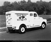 Rear view of a Jarman Motors Good Humor ice cream truck. The side reads "Good Humor Ice Cream," with a large graphic of a partially eaten ice cream bar. The rear reads "Ice Cream Sold Here It's Pure Cream Pints In All Flavors." The truck is numbered 55.