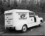 Rear view of a Good Humor ice cream truck. The side reads "Ice Cream Good Humors" with a large graphic of a partially eaten ice cream bar. The rear reads "Ice Cream Sold Here It's Pure Cream Pints In All Flavors," and the door reads "Buy Them Here." The truck is numbered 91.