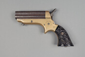 Four barrel, .22-caliber Pepperbox pistol with fancy grips and serial number 14090. It is engraved "C. Sharps & Co. / Philadelphia, PA."