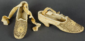 Pair of beige velvet ladies' wedding slippers with oval toe, covered Cuban heel, and embellished with beads and seed pearls. Worn for the wedding of Grace and Edward Greenway on January 19, 1847.