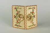 White satin card case with central hand-painted medallion portraits on each side, surrounded by floral embroidery. On one side the portrait shows a woman with brown hair, while the portrait on the other side shows two young children. The case belonged to Mrs. Charles Carroll (nee Margaret Tilghman, 1742-1817) of Mount Clare in Baltimore, Maryland.