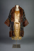 Gold velvet flapper dress and silk-velvet brocade jacket with parrot motif, gold silk lining, and fur trim.