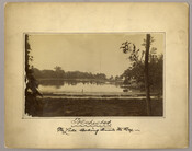 View of a figure walking on the edge of the lake at the Tolchester Beach Amusement Park in Tolchester, Maryland. This Kent County park consisted of a bathing beach, amusement park, racetrack, and hotel, and was in operation from 1877 to 1962. It was a popular vacation destination for Baltimoreans as it was only 27…