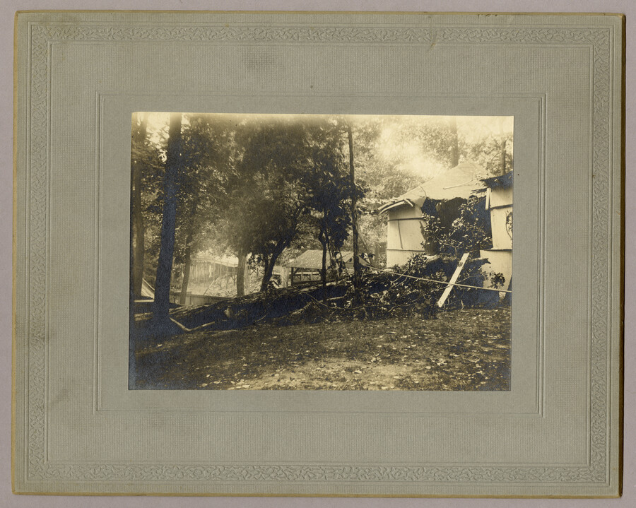 Damaged structures and felled trees following a storm and flood in Tolchester, Maryland. Tolchester was the site of the Tolchester Beach Amusement Park, which consisted of a bathing beach, amusement park, racetrack, and hotel, and was in operation from 1877 to 1962. The Kent County park was a popular vacation destination for Baltimoreans as it…