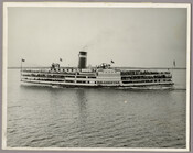 A view of the steamship "Tolchester," owned by the Tolchester Steamboat Company, carrying passengers across the Chesapeake Bay. The company ran daily excursion steamships to the Tolchester Beach Amusement Park in Kent County, Maryland, from its pier at Light Street in Baltimore City.