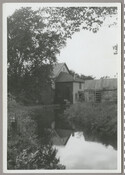 View of the Higman Mill located in Millington, Maryland. The building is reflected in the water of the Chester River. Also known as the Massey Mill and Gilpin's Mill, this flour and grist mill was in operation from 1763 until 1954 and is the only existing 18th century mill structure in Kent County, Maryland.