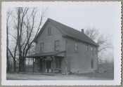 View of a store in Sandy Bottom, Maryland. The building stands isolated next to a road and appears to be deserted.