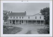 Front view of the William Medders & Co. store located in Still Pond, Maryland. Three figures stand under the sign on the porch of the building, while one figure stands in the doorway. William Medders purchased the store from George Harper and operated it from 1894 to 1959. Medders expanded the business by selling housewares…