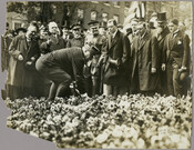 A crowd observes the Marshal of France, Joseph Jacques Césaire Joffre, breaking ground at the proposed site for a monument to the Marquis de Lafayette located on the east side of Mount Vernon Place, Baltimore, Maryland. Mayor of Baltimore James H. Preston, second from left, and other officials look on. Joffre visited the city as…