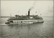 A view of the steamship "Express," owned by the Tolchester Steamboat Company, carrying passengers across the Chesapeake Bay. The company ran excursion steamships to the Tolchester Beach Amusement Park in Kent County, Maryland, from its pier at Light Street in Baltimore City. Verso: With the compliments of Father Newton Thompson 1932